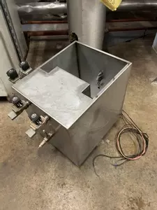 Custom-built stainless steel replacement tank assembled and ready for installation on a Nilfisk Delta Booster multi-pump pressure washer system.